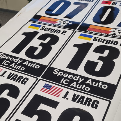 Collection of racing decals with numbers and brand logos on a white background